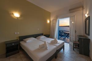 Posteľ alebo postele v izbe v ubytovaní Angeliki Seaside Hotel