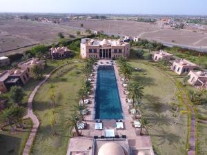an aerial view of a large house with a swimming pool at O'Atlas in El Harkat