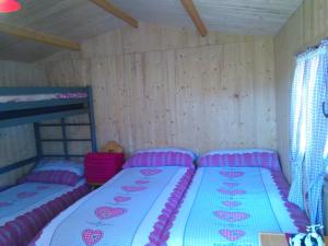 Postel nebo postele na pokoji v ubytování Pilger-Hüttli - Blockhaus