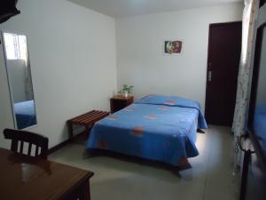 Ένα ή περισσότερα κρεβάτια σε δωμάτιο στο Hotel Estación Central