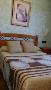 Postel nebo postele na pokoji v ubytování Hostal Guarni
