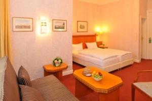 Postel nebo postele na pokoji v ubytování Hotel Schmidt