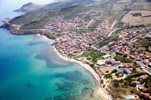an aerial view of a town next to the ocean at Best Western Hotel Blumarea in Castelsardo