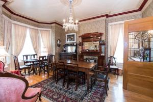 a dining room with a table and chairs at A Tanners Home Inn Bed and Breakfast in Saint John