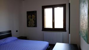 Postel nebo postele na pokoji v ubytování La Baia Casa Vacanze