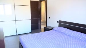 Postel nebo postele na pokoji v ubytování La Baia Casa Vacanze