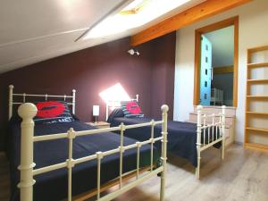 A bed or beds in a room at Escape with Bubble Bath