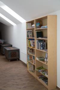 a room with book shelves filled with books at Penzion U Rudolfů in Vlasenice