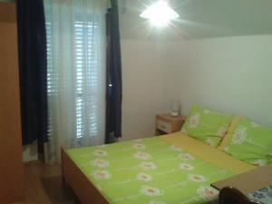 Postel nebo postele na pokoji v ubytování Apartments Alissa