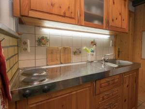 a kitchen with a sink and a counter top at Luxurious Bungalow in Neustadt Harz with Private Terrace in Ilfeld