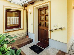 a front door of a house with a window at Apartment near the forest in Plankenstein in Plankenfels