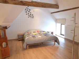 a bedroom with a bed with stars on the wall at Modern Holiday Home in Senzeille with Garden in Senzeille