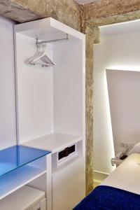 Posteľ alebo postele v izbe v ubytovaní Atarazanas Málaga Boutique Hotel