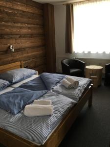 Postel nebo postele na pokoji v ubytování Hotel Kristian