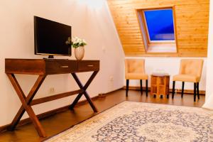 TV a/nebo společenská místnost v ubytování Casa Natalia