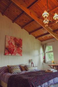 Postel nebo postele na pokoji v ubytování Casa Pocahullo