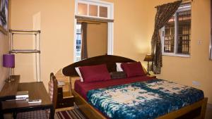 מיטה או מיטות בחדר ב-Jesiwa B's Little Palace