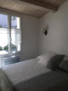 Cama ou camas em um quarto em Locations Ile de Ré