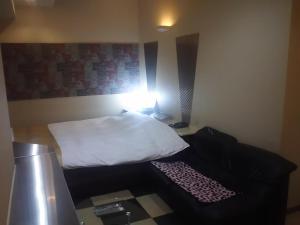 Postel nebo postele na pokoji v ubytování Hotel Sting