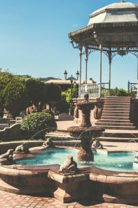 a fountain in a park with a gazebo at Santa Elena Hotel Boutique in Mascota