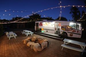 a food truck parked in a parking lot at night at Adventure Inn Marahau in Marahau