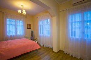A bed or beds in a room at Oikia Preveza