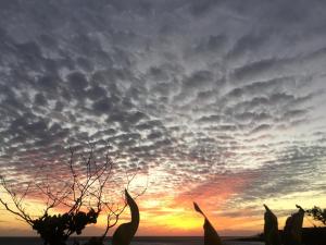 The sunrise or sunset as seen from a panziókat or nearby
