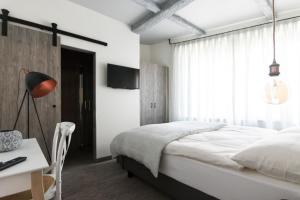 Letto o letti in una camera di Seven Boutique Hotel