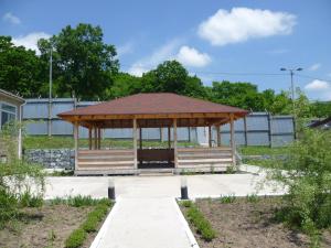 a gazebo with a roof in a park at Hotel Complex Vostok in Vrangel'