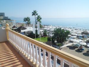 a balcony of a resort with a view of the beach at Apartamentos Don Pepe in Torremolinos