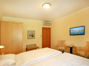 Postelja oz. postelje v sobi nastanitve Hotel Garni Golf