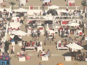 a beach filled with people and umbrellas at Apartment Beach in Blankenberge
