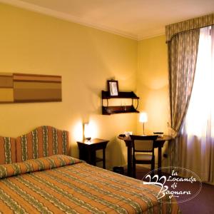 Postel nebo postele na pokoji v ubytování Hotel Locanda Di Bagnara