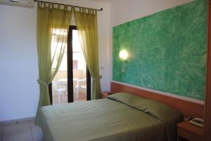 Postel nebo postele na pokoji v ubytování Hotel Maria
