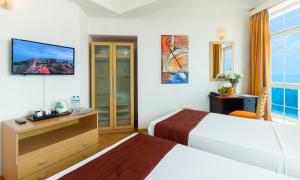 Voodi või voodid majutusasutuse Global Towers Hotel & Apartments toas