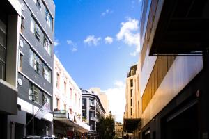 a view of a city street with tall buildings at InnsCape on Castle Hotel in Cape Town