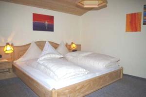 Postel nebo postele na pokoji v ubytování Appartementhaus Sennhüttn
