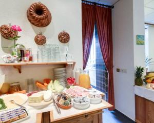 a kitchen with a counter with food on it at Regina in Heidelberg