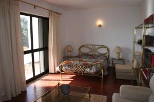 Cama ou camas em um quarto em Monte Dos Netos