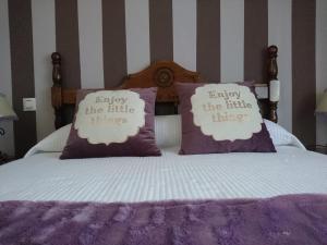 A bed or beds in a room at Posada El Jardin