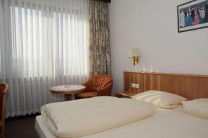 Postel nebo postele na pokoji v ubytování Hotel Göller