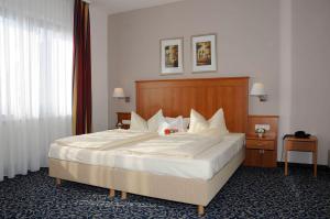 Postel nebo postele na pokoji v ubytování Hotel Göller