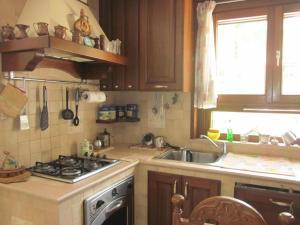 a kitchen with a sink and a stove at Bed&Breakfast Le Valli del Cerrano in Pineto +38 photos