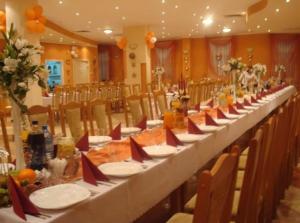 a long long table in a room with chairs at Pasja in Kwidzyn