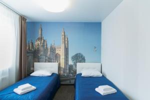 מיטה או מיטות בחדר ב-Hotel Cambridge