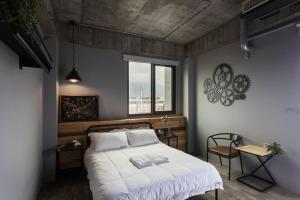 Ένα ή περισσότερα κρεβάτια σε δωμάτιο στο Railway Hualien Hostel