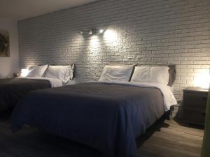 Postel nebo postele na pokoji v ubytování Complexe Dix80
