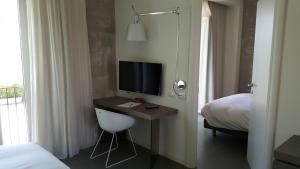 A bed or beds in a room at Hotel & Resort Le Colombare