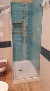 a shower with a glass door in a bathroom at B&B VIA VENETO in Crotone
