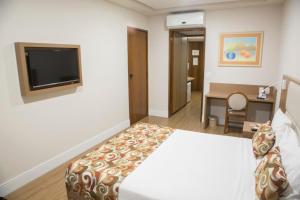 Кровать или кровати в номере Mirador Rio Copacabana Hotel